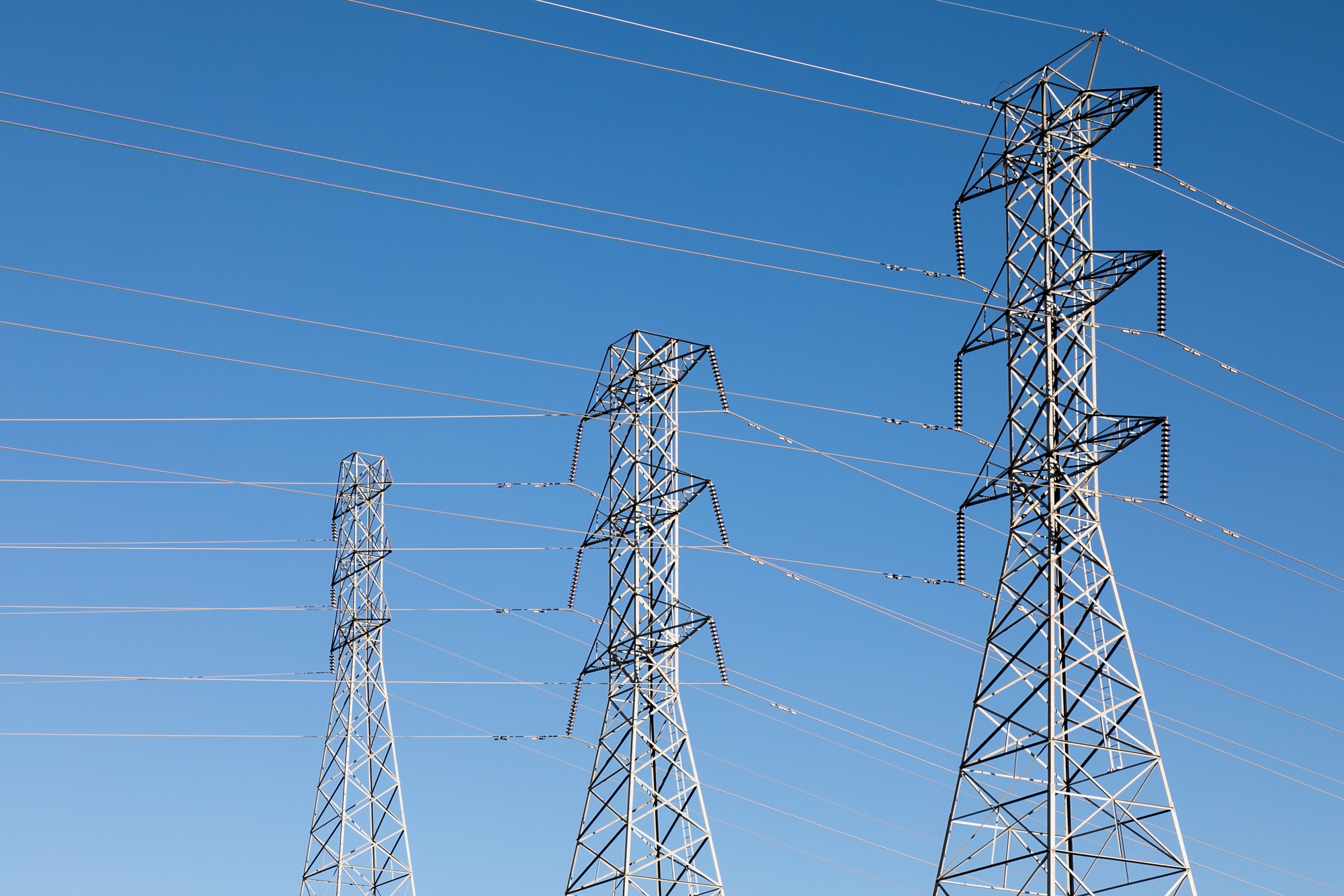 beautiful-shot-electric-poles-blue-sky